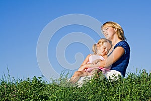 Woman and little girl enjoying sunshine