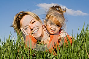 Woman and little girl in the grass