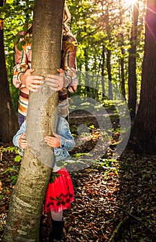 woman and little girl hands hugging a tree - fight climate change, save planet earth for our children