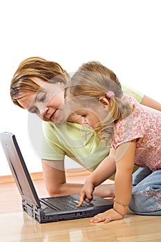 Woman and little girl with laptop