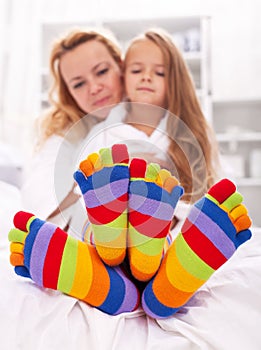 Woman and little girl wearing funny socks