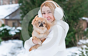 Woman with a little golden dog outdoor portrait