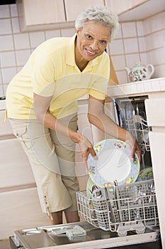 Woman Loading Dishwasher