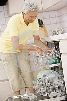 Woman Loading Dishwasher