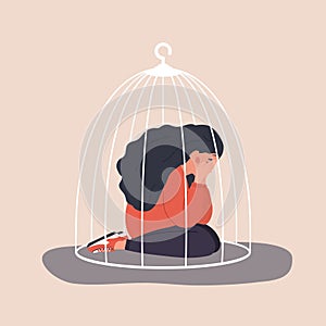 Woman locked in cage. Sad teenager sitting on floor and crying. Social isolation concept. Female empowerment movement