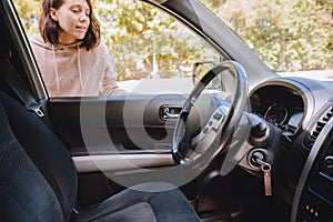 woman locked car and forget keys inside photo