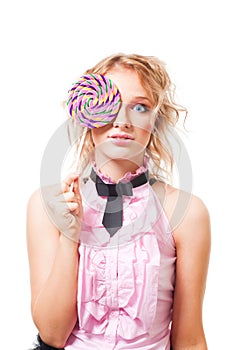 Woman with lollipop in pink dress