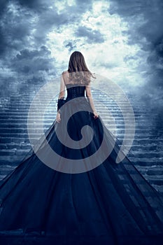 Woman in Long Dress Back Rear View Climbing Stone Stairs to Sky, Girl Raising Dark Night