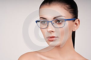 Woman with long eyelashes in eyeglasses