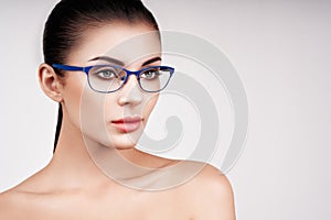 Woman with long eyelashes in eyeglasses