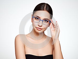 Woman with long eyelashes in eyeglasses