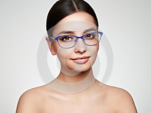 Woman with long eyelashes in eyeglasses