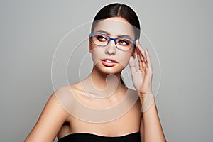 Woman with long eyelashes in eyeglasses