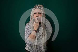 Woman With Long Hair Covering Her Mouth