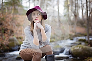 Woman with long hair, fedora hat
