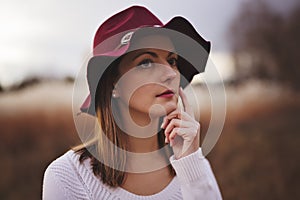 Woman with long hair, fedora hat