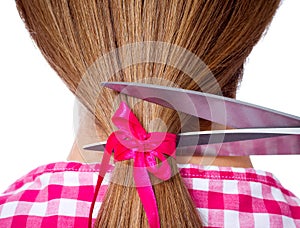 Woman with long hair and scissors cutting