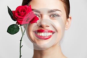 Woman with long hair Smile rose close-up clear skin