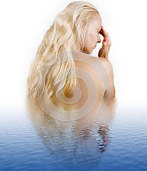 Woman with long hair in a water
