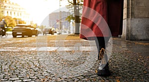 Woman In Long Red Skirt And Black Boots