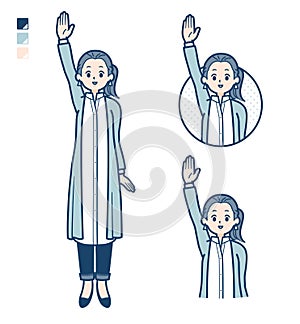 A woman in a long shirt with raise hand images