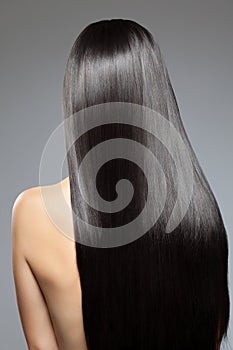 Woman with long straight shiny hair