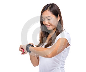 Woman look at her smart watch for heart beat rate