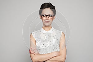 Woman looking aside with a smirk photo