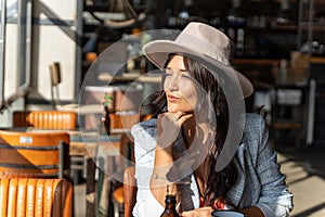 Woman looking away while sitting in a coffee shop