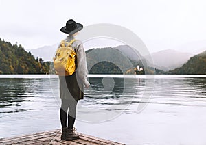 Woman looking at beautiful Lake Bled. Tourist travel in Slovenia, Europe