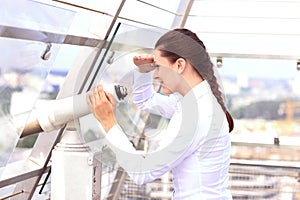 Woman looking through binoculars