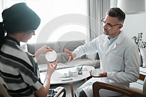 Woman looking at breast implants before having surgery