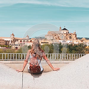 woman looking at Cordoba mosque and cathedral