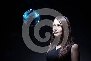 Woman looking at disco ball