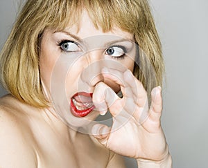 Woman looking disgusted.