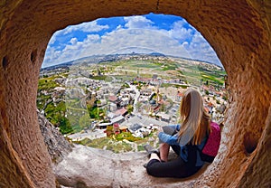 Woman looking into the distance against the background of incredible landscape