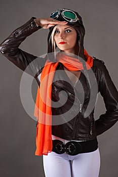 Woman looking into the distance in aviator helmet