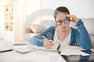 Woman looking distressed over bills