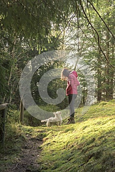 Woman looking down to her dog