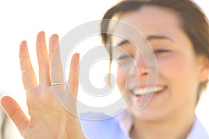 Woman looking an engagement ring after proposal