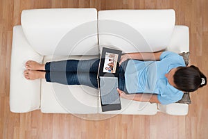 Woman Looking At Family Photo Album