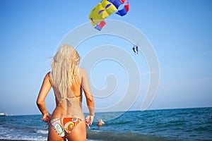 Woman looking forward to a paragliding adventure