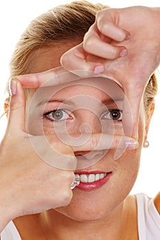 Woman looking through a frame