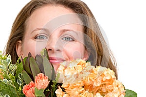 Woman Looking Genuinely in to your Eyes Behind the Flower Bouquet