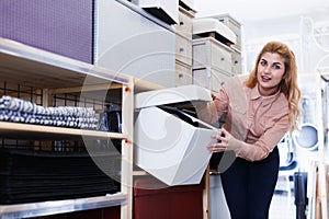 Woman looking for hassock in store