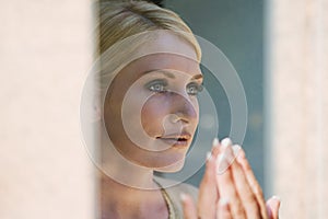 Woman looking at her reflection