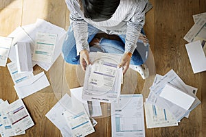 Woman looking at the house bills