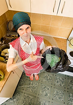 Woman Looking inside a Trash Can