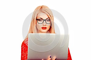 Woman looking at laptop .