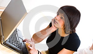 Woman looking at laptop